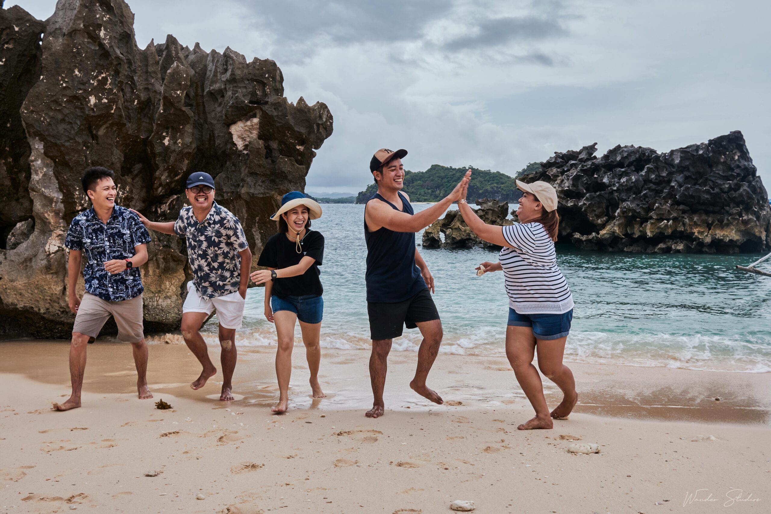 Group of friends enjoying a happy day on Caramoan Beach, Philippines. Vibrant and lively scene of people bonding.